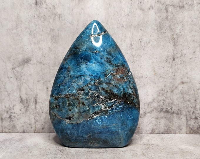 Blue Apatite with vibrant depth of color, glassy luster and polished finish. Natural intensity in a compact teardrop shape