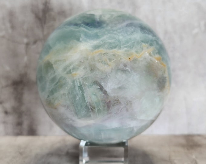 Pastel Fluorite Sphere: Promotes peace, clarity and intuition. A soft, calming stone with a serene appearance and spiritual power.