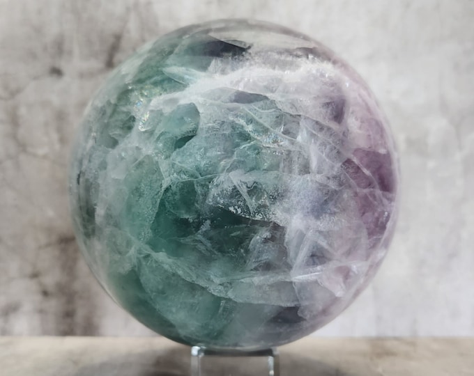 Rainbow Fluorite ball: rainbow fluorite in purple and green. For clarity, focus and balance. Ideal for your altar or meditation place.