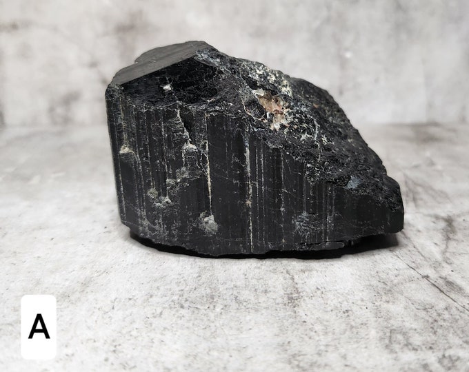 Raw Black Tourmaline: Unpolished, protective and grounding properties. Absorbs negative energy and promotes emotional balance.