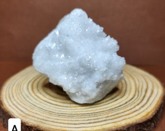 White Quartz Geode: Purity and energetic amplification. It radiates clarity and uplifts any space with its purifying energy.