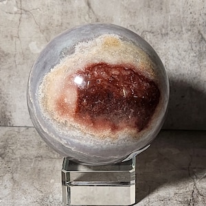Bandagate ball with natural earth layers. Brings stability, peace and balance. A harmonious addition to any space or altar.