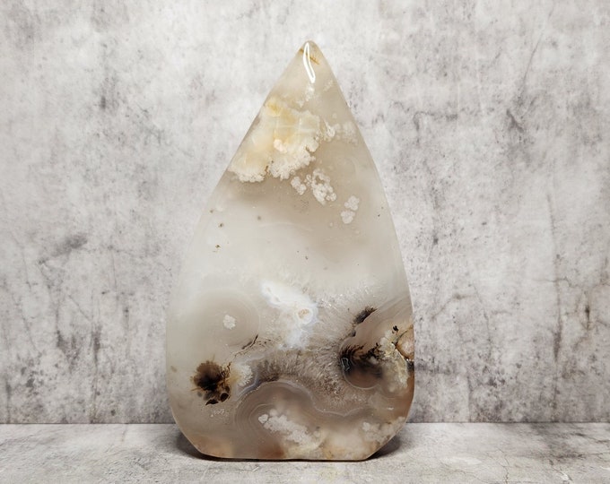 Ocean Jasper in teardrop shape with beige and white patterns. Soft layers make this piece visually unique. Promotes calmness and mental clarity