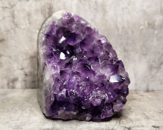 Amethyst Geode: Purple splendor for tranquility and spiritual growth. Add serenity to your space with this enchanting formation.