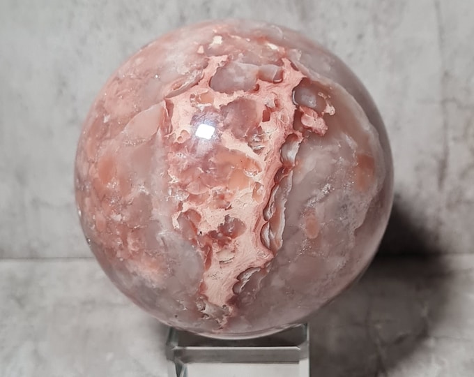 Red Flower Agate, with its vibrant red and pink flower-like patterns, promotes emotional healing and personal growth.