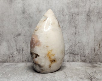 Pink Agate supports integration and stability. A mineral known for its slow build and calm, earthy energy.