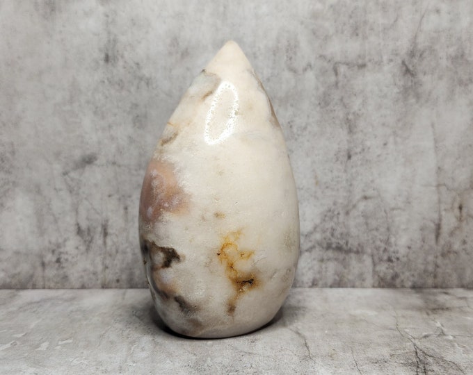 Pink Agate supports integration and stability. A mineral known for its slow build and calm, earthy energy.