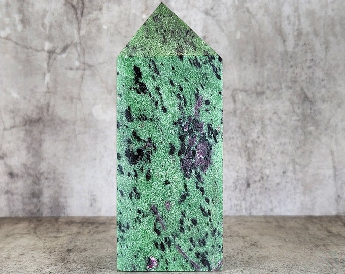 Ruby in Zoisite: Combines the passion of ruby with the grounding energy of zoisite. Promotes vitality, joy and spiritual awareness.