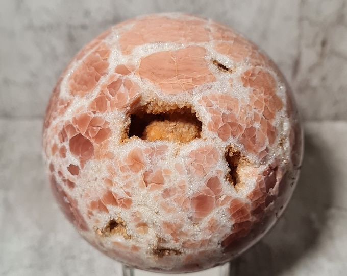 Pink Mangano Calcite sphere with druzy openings: promotes self-love, emotional healing and gentleness – perfect for heart chakra work.