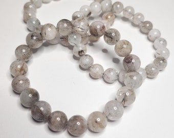 Red-silver rutile quartz: A clear quartz with fine red and silver rutile needles. Promotes energy, passion and clarity of mind.