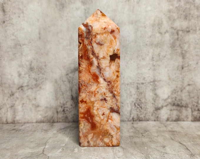 Red Agate with warm earth tones, rough details and layering. Brings strength, peace and protection. Each piece is natural and uniquely formed.