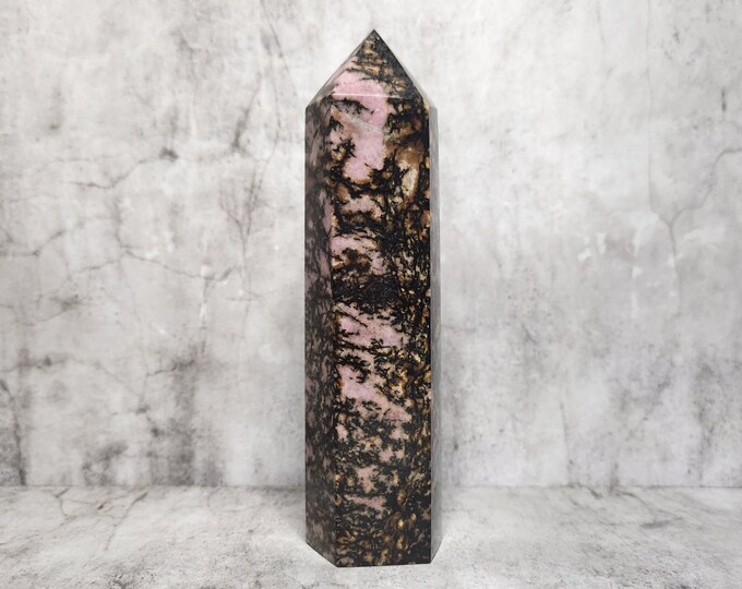 Rhodonite: A beacon of love and personal growth. Stimulates emotional well-being and authentic expression. Brings harmony to relationships.