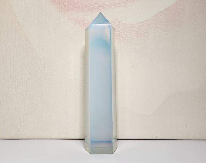 Opalite: Man-made glass, promotes emotional balance, communication and spiritual growth. Relieves stress and anxiety and supports meditation.