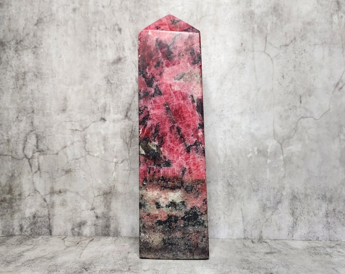 Rhodonite Tower: Emotional healing, self-love, relationship enhancement. Stimulates self-expression, compassion. Beneficial for physical healing.