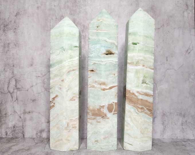 Pistachio Calcite Tower: Calms, promotes creativity. Stimulates optimism. Perfect for emotional well-being and meditation.