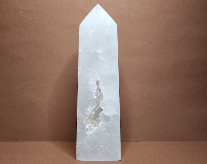 White rock crystal tower with natural inclusion and druzy crystals. Works purifying, helps with clear thinking and releasing blockages.