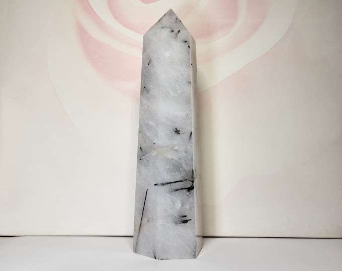 Tourmaline Quartz: Quartz with black tourmaline inclusions, protective properties and promoting balance and clarity.