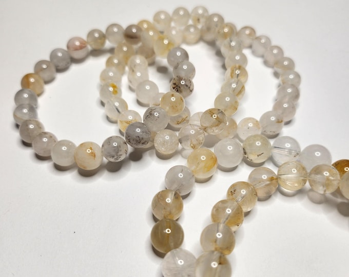 Quartz Limonite: Clear quartz with yellow-brown limonite. Clarity of mind, positivity and emotional balance. Grounding and protective.