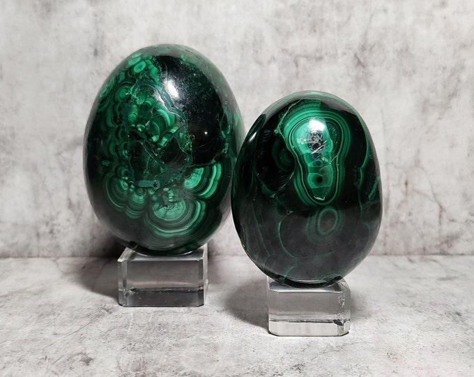 Malachite Egg: Deep green stone with swirl patterns. Protects, absorbs negative energy, promotes transformation and emotional balance