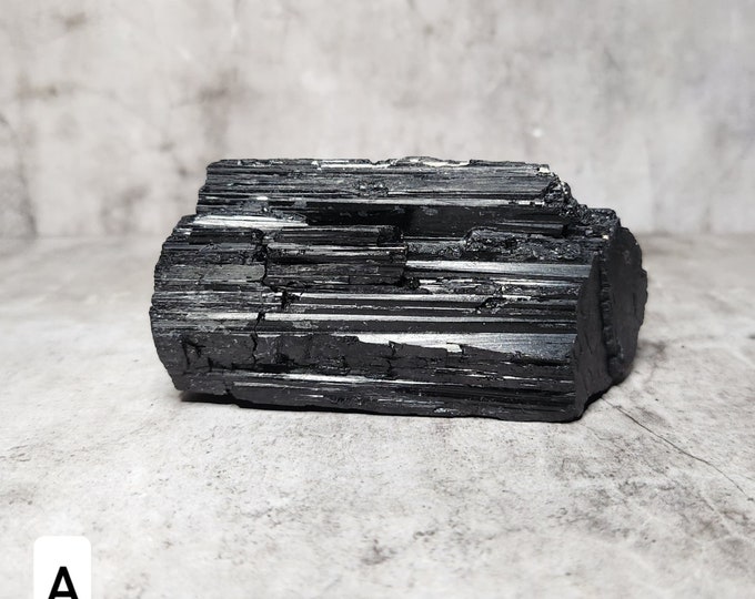 Raw Black Tourmaline: An unpolished gemstone that protects and grounds. Absorbs negative energy and promotes emotional stability.