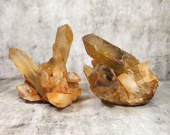 Citrine cluster with oxidation: Promotes vitality, optimism, creativity. Helps manifest abundance and success and full of fire.