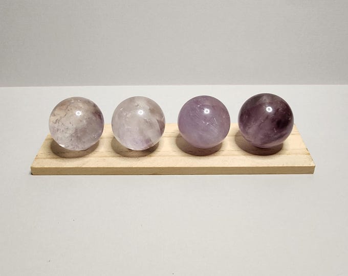 Clear Amethyst Pearl: Purple stone that encourages calmness, balance and spiritual growth. Reduces stress and enhances intuitive abilities.