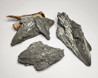 Kyanite Black with silver Aura coating blades. Calms, encourages open and honest communication, associated with balance and harmony