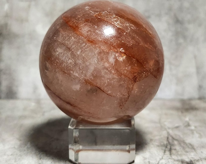 Fire Quartz Sphere: Powerful stone that enhances passion and courage, ignites creativity and dispels fears, stimulating action