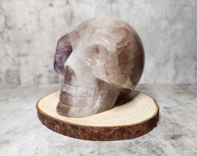 Amethyst-Smoky Quartz Skull: Combination of purple amethyst and dark brown smoky quartz. Promotes spiritual growth, balance and protection.