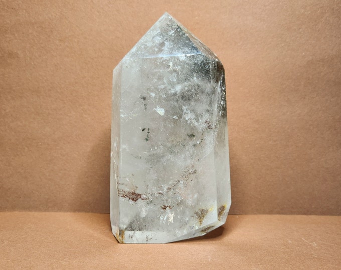 Rock crystal with moss-like pattern. Strengthens intentions, brings clarity and radiates peace. Light reveals the depth of the crystal.