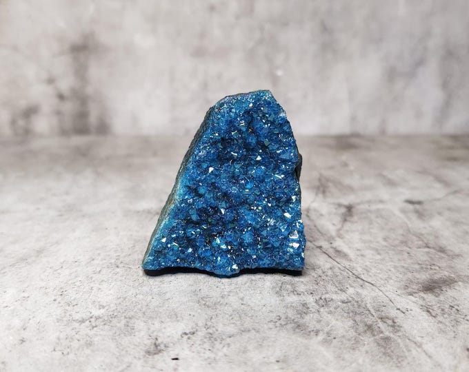 Blue Aura Quartz: Man-made colored by combining metals, gold and silver with quartz. Iridescent blue shine and calming energy.