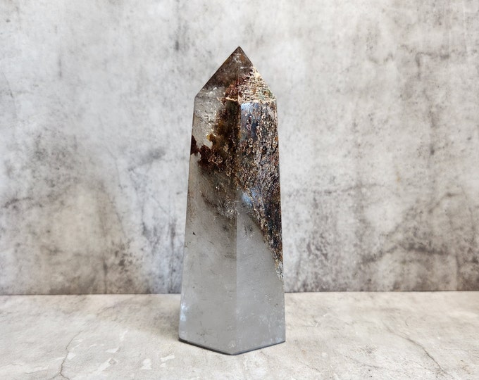 Rock crystal with earthy mineral inclusions. Promotes clear thinking, purification and tranquility. Each piece has a unique natural pattern.