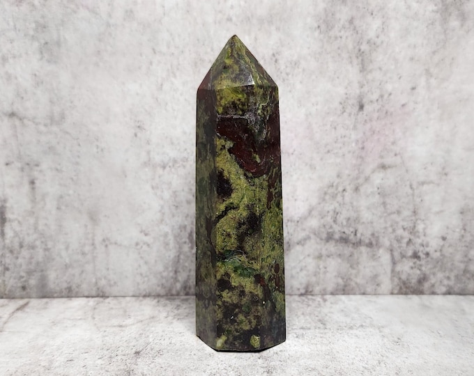 Dragon's Blood Jasper activates strength and courage. Perfect for those seeking stability and renewed energy in their crystal collection.