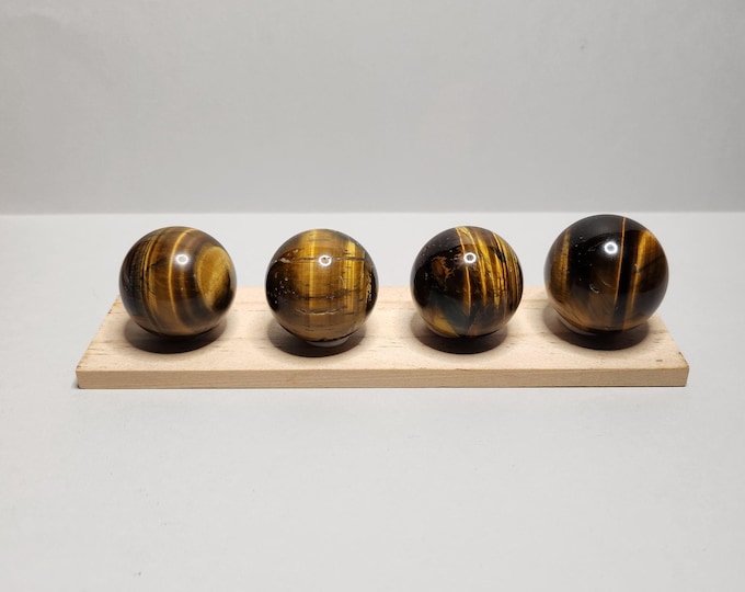 Tiger Eye Pearl: Golden brown stone that promotes self-confidence and courage. Offers protection and helps with focus and emotional balance.