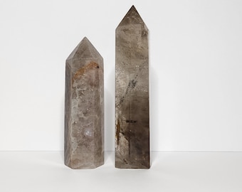Smoky Quartz: Grounding energy, protects against negativity, promotes clear thinking. Powerful stone for stability and emotional balance.