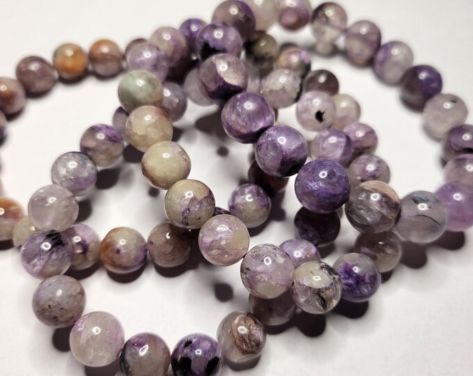 Charoite: Rare purple gemstone that promotes inner strength, transformation and intuition. Can aid in emotional healing.