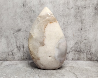 Pink Agate supports integration and stability. A mineral known for its slow build and calm, earthy energy.