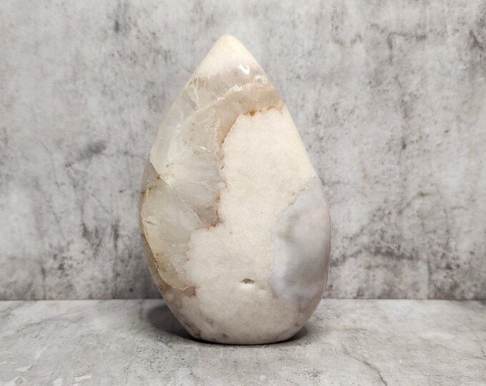 Pink Agate supports integration and stability. A mineral known for its slow build and calm, earthy energy.
