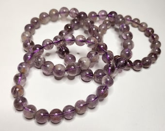 Amethyst phantom: Interwoven with other minerals. This creates a layered effect with beautiful different colors and inclusions.