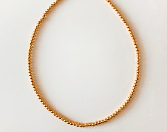 Gold beaded choker