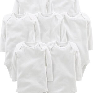May include: A set of seven plain white long-sleeve bodysuits for infants. Each garment features a round neckline, expandable shoulders for easy dressing, and a snap-button closure at the bottom. The fabric is a solid, opaque white throughout.