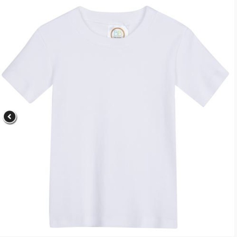 May include: A plain white t-shirt with a small, round label on the front.