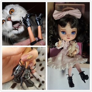 May include: A pair of black ankle boots with laces and a chunky heel. The boots are made of shiny patent leather and have a pointed toe. The boots are shown on a doll's feet and on a hand holding the boots.
