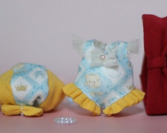 May include: Three handmade doll clothes: a blue and yellow dress with a white bow and a bear print, a blue and yellow hat with a crown, and a red headband.