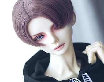 May include: A doll with a short, straight, purple wig. The wig has a side part and is styled with a slight curve at the ends. The doll is wearing a black hoodie with white text that says "NICE NICE".