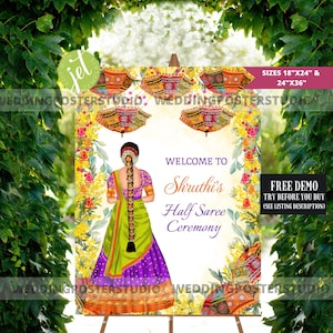 May include: Welcome to Shruthi's Half Saree Ceremony sign featuring a colourful floral design and a woman in a green and purple saree. The sign is available in 18"x24" and 24"x36" sizes.
