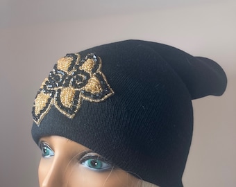 Black knit slouchy beanie with gold and black beaded applique, unusual and pretty!