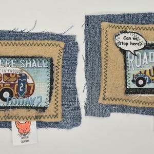 May include: Two rectangular fabric patches featuring denim borders, tan felt frames, and printed graphics. The left patch shows a camper with the text WHERE SHALL WE GO TODAY. The right patch shows a car with the text ROAD TRIP and Can we stop here. Both have a small fox logo tag.