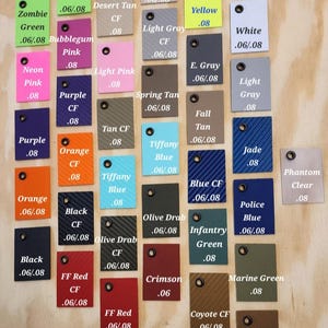 May include: A chart of 25 color swatches with names and numbers. The colors include Zombie Green, Desert Tan, Yellow, White, Light Gray, E. Gray, Light Gray, Jade, Phantom Clear, Police Blue, Marine Green, Coyote, Coyote CF, Crimson, Olive Drab, Olive Drab CF, Black CF, Orange CF, Purple CF, Tiffany Blue, Blue CF, Fall Tan, Spring Tan, Tan CF, Neon Pink, Light Pink, Bubblegum Pink, and FF Red.