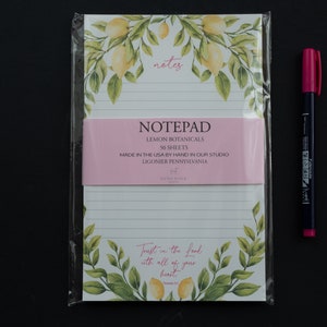 May include: A notepad with a lemon botanical design and the text "notes" at the top. The notepad has 50 sheets and is made in the USA by hand in Ligonier, Pennsylvania. The notepad also features the text "Trust in the Lord with all of your heart."